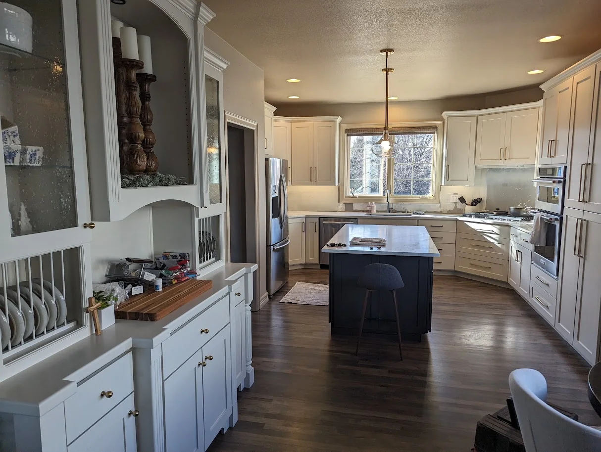 The same kitchen with new white shaker doors after refacing